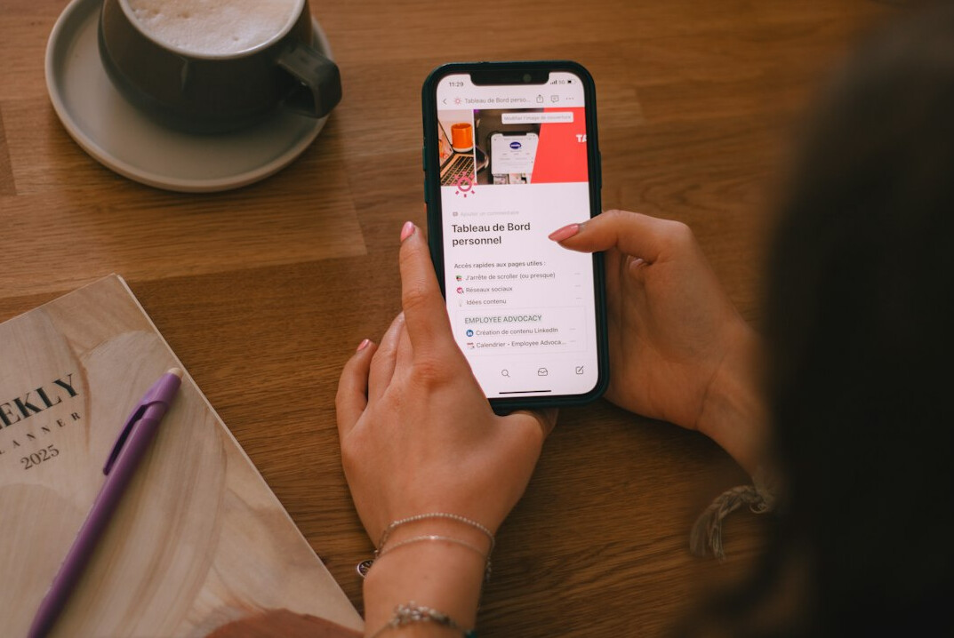 person reading news on phone