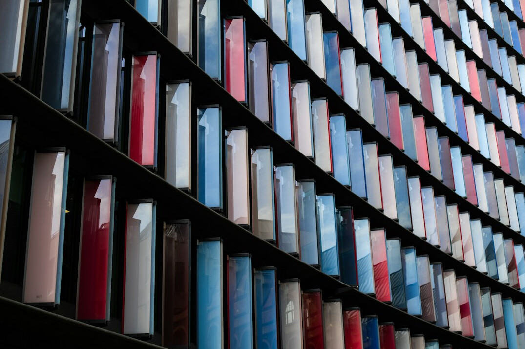Tall archive shelves filled with bound documents