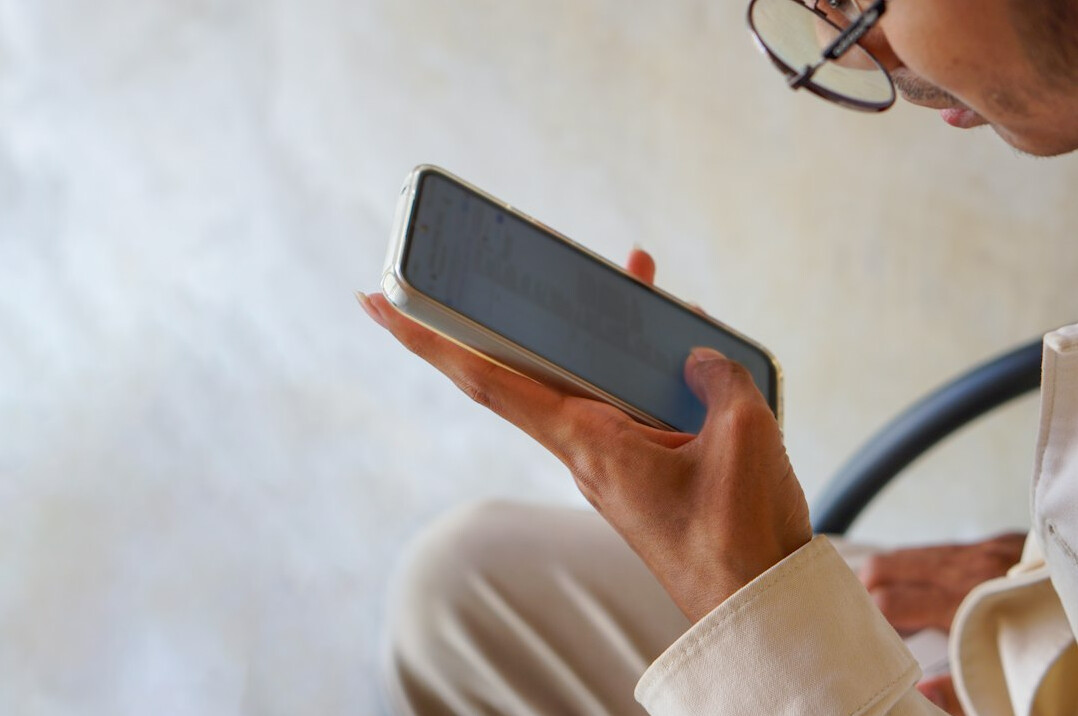 person scrolling on phone